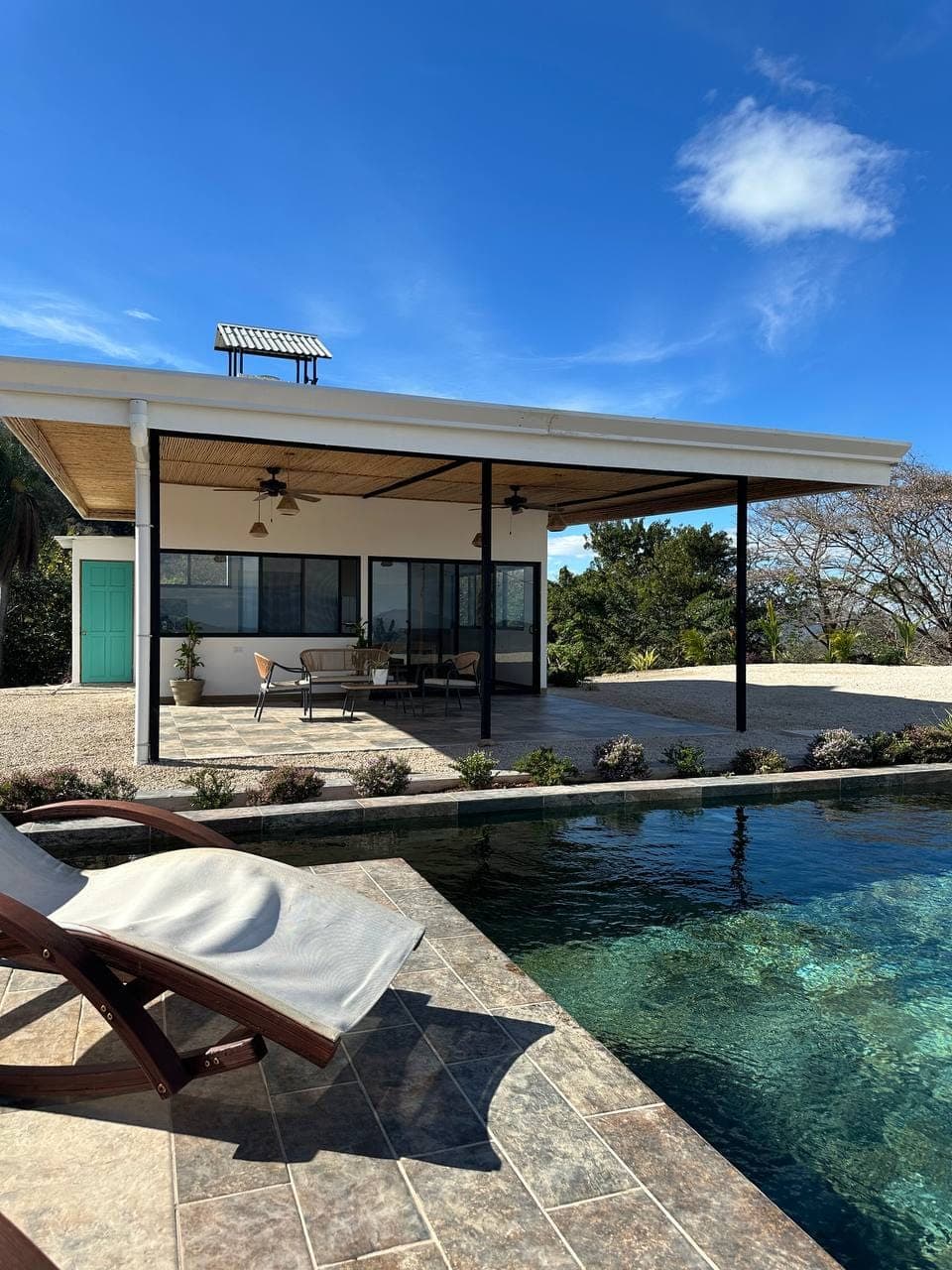 Full view infinity pool covered terrace mountain view exclusive luxury vacation rental Bluesky Lodge Costa Rica