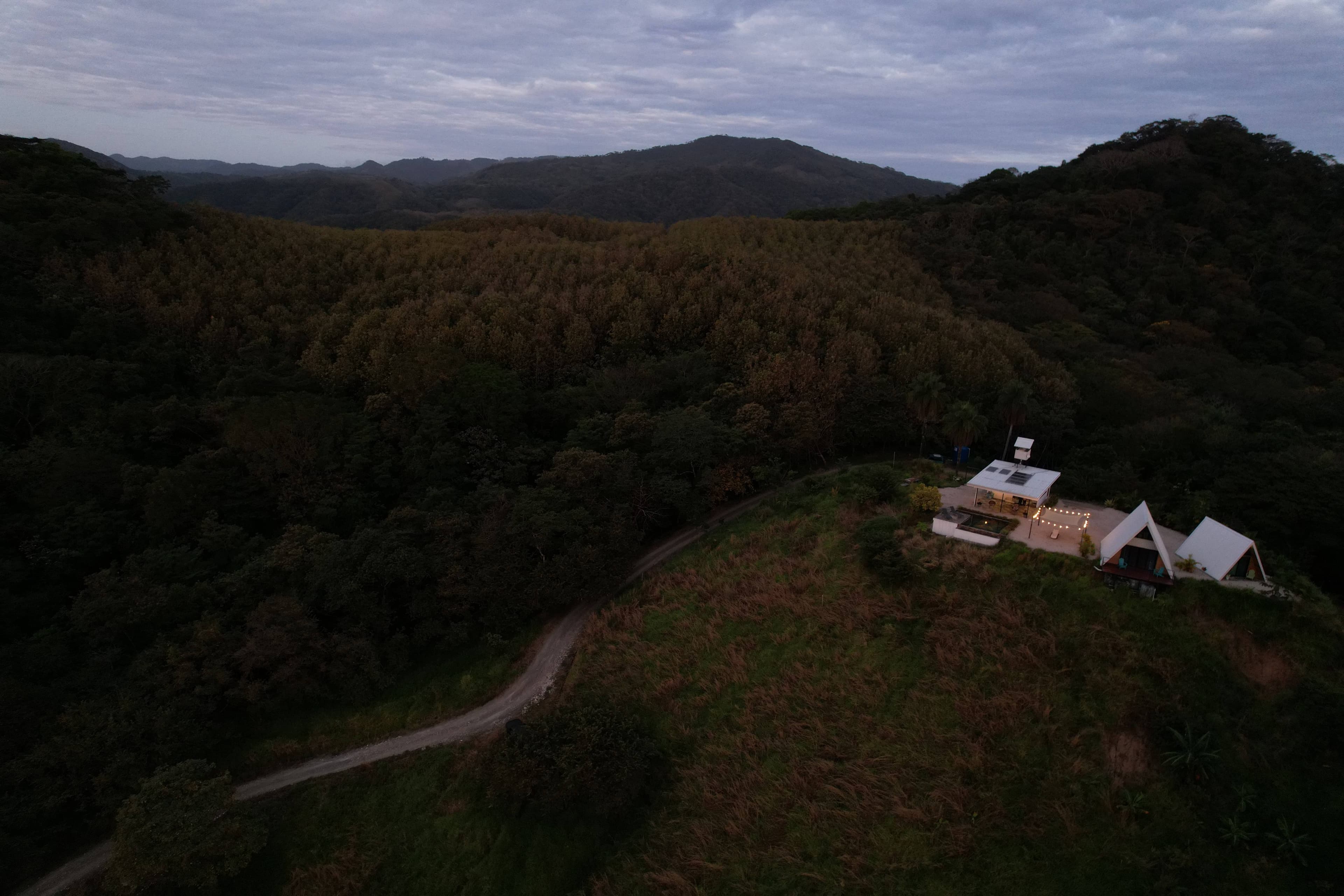 Night illuminated lodge Blue Zone mountainous landscape luxury vacation rental Costa Rica retreat