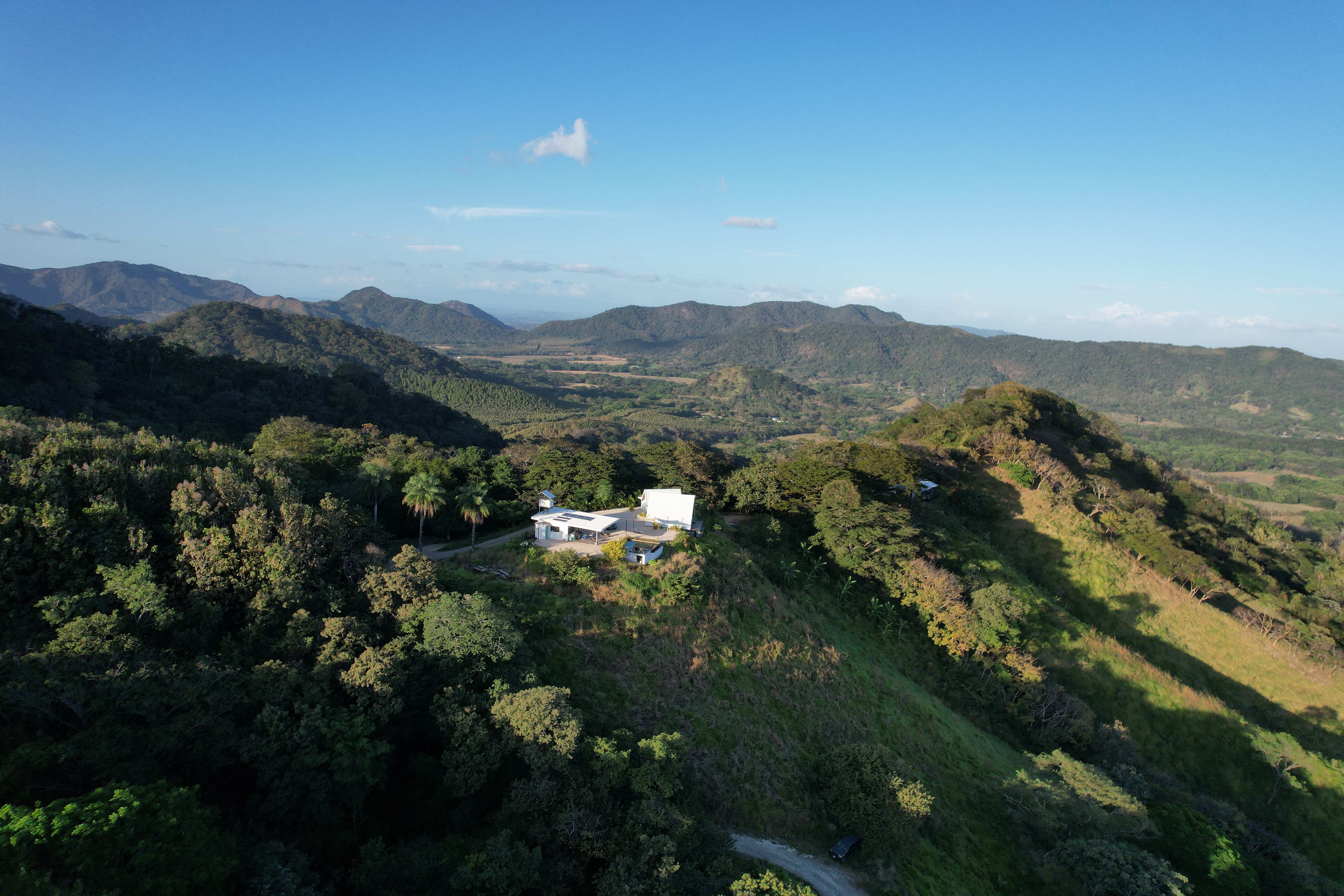 Daytime aerial view of Bluesky Lodge in the Blue Zone mountains of Nicoya, Costa Rica