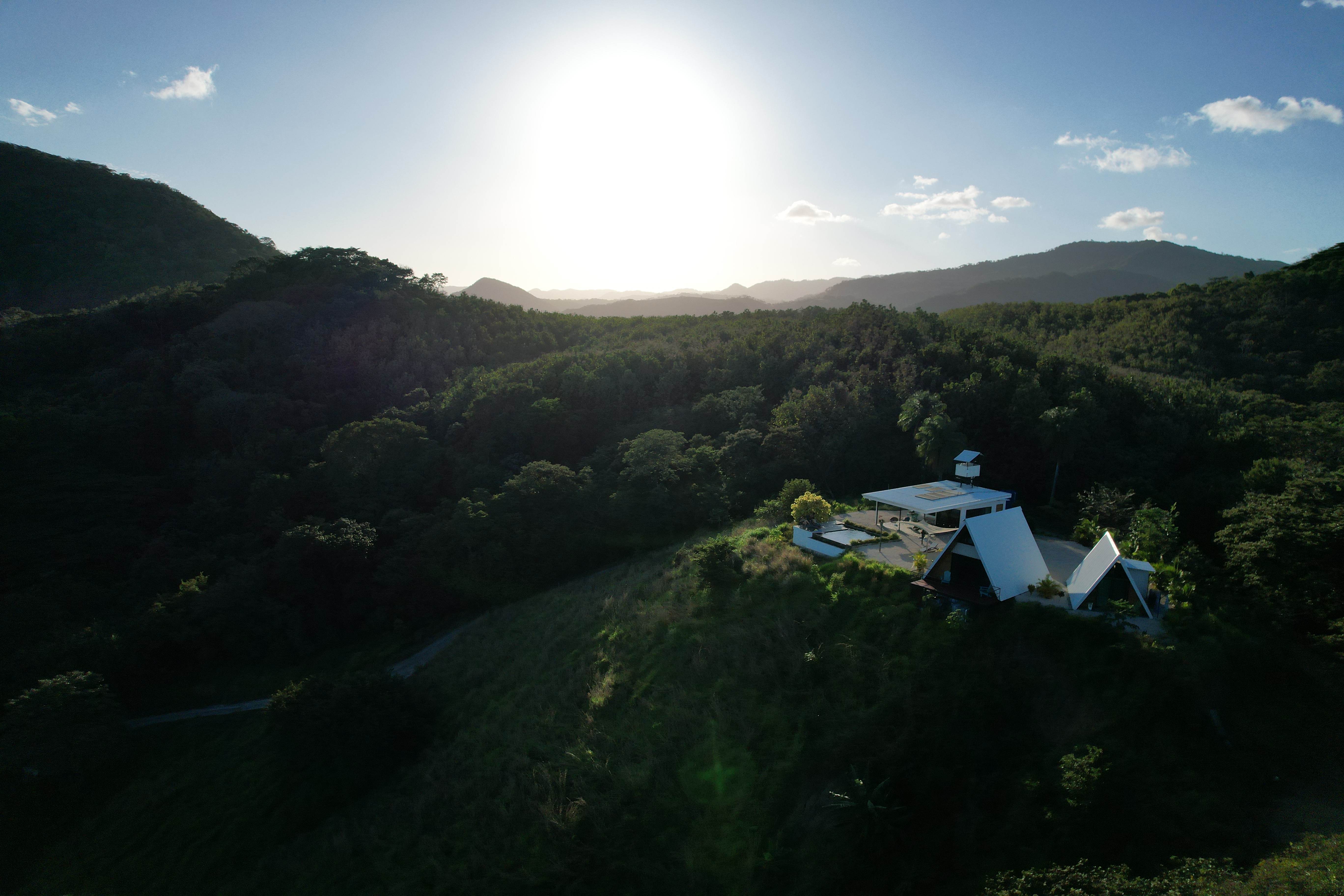 Bright daylight aerial view of the upscale lodge in the mountainous landscape of Costa Rica