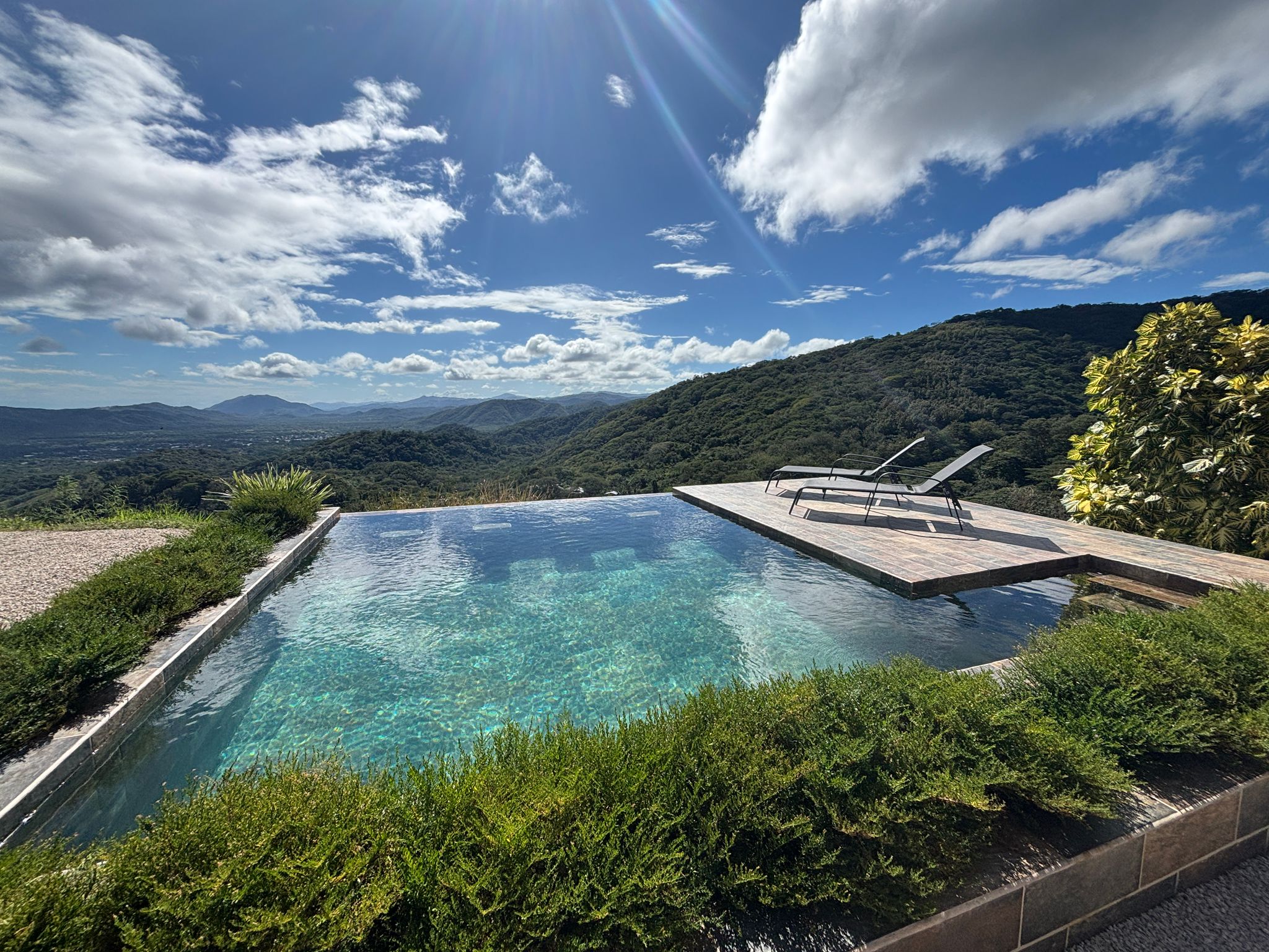 Bluesky Lodge infinity pool with 180-degree panoramic view of Blue Zone mountains, Guanacaste Costa Rica vacation rental